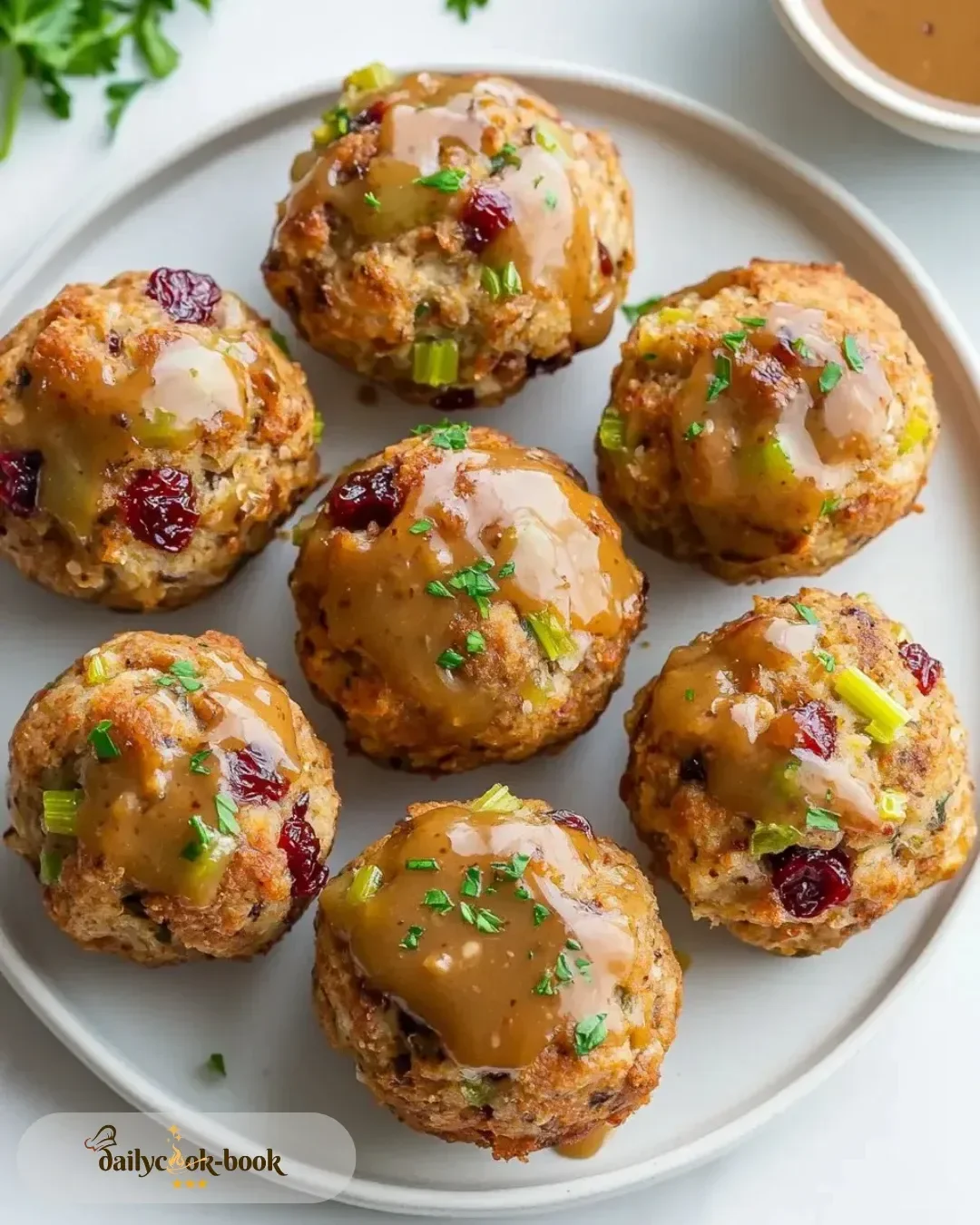 Cranberry Turkey Stuffing Balls served on a festive holiday table.